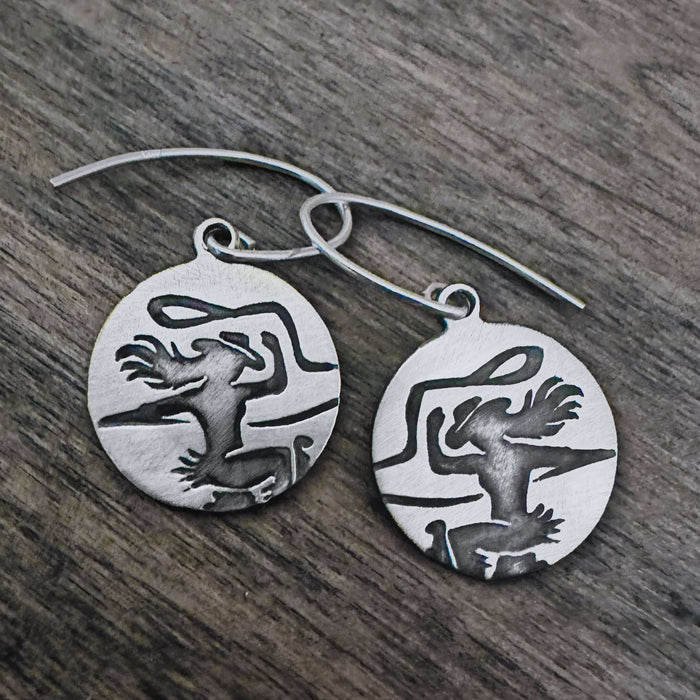Cowgirl Earrings crafted in matte silver featuring an etched cowgirl design, perfect for a stylish casual look.
