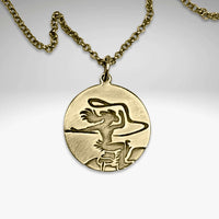 Cowgirl Necklace pendant featuring a cowgirl riding a horse with her hair flying in the wind.