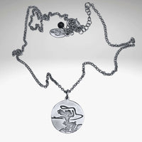 Cowgirl Necklace featuring a pendant of a cowgirl riding a horse on a silver rolo chain