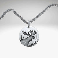 Creek Moose Necklace pendant on rolo chain, handmade in Montana, available in matte silver finish.