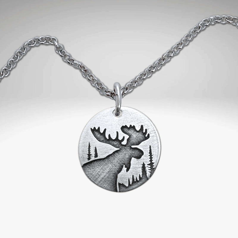 Creek Moose Necklace pendant on rolo chain, handmade in Montana, available in matte silver finish.