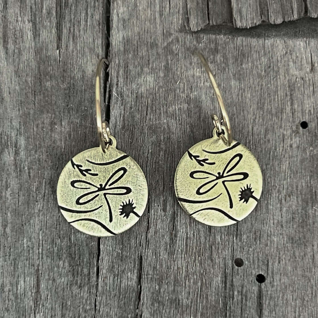 Dragonfly Earrings featuring intricate etched design on raw brass with simple dragonfly and stems detail.
