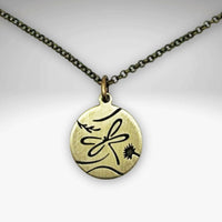 Dragonfly Necklace featuring a beautiful antique brass pendant on an adjustable chain.