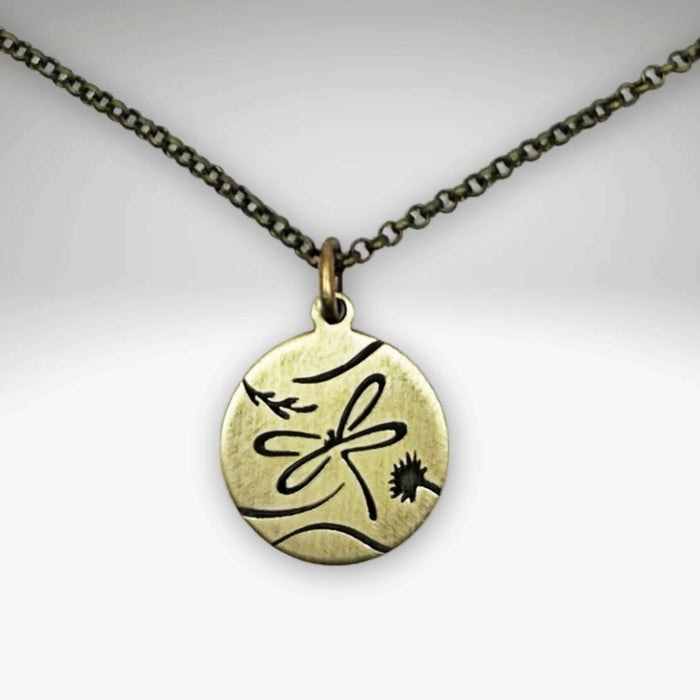 Dragonfly Necklace featuring a beautiful antique brass pendant on an adjustable chain.