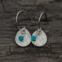 Drops Earrings featuring hand texturized brass teardrop and turquoise jade bead, perfect for all-day wear.