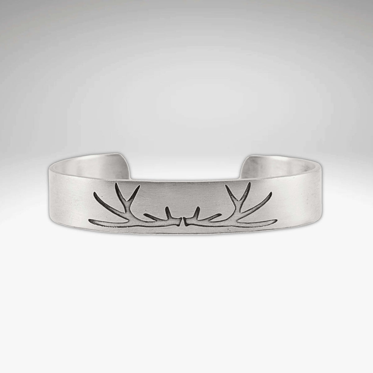 Elk Antlers Cuff Bracelet with subtle etching of elk antlers in Matte Silver finish, adjustable cuff design.