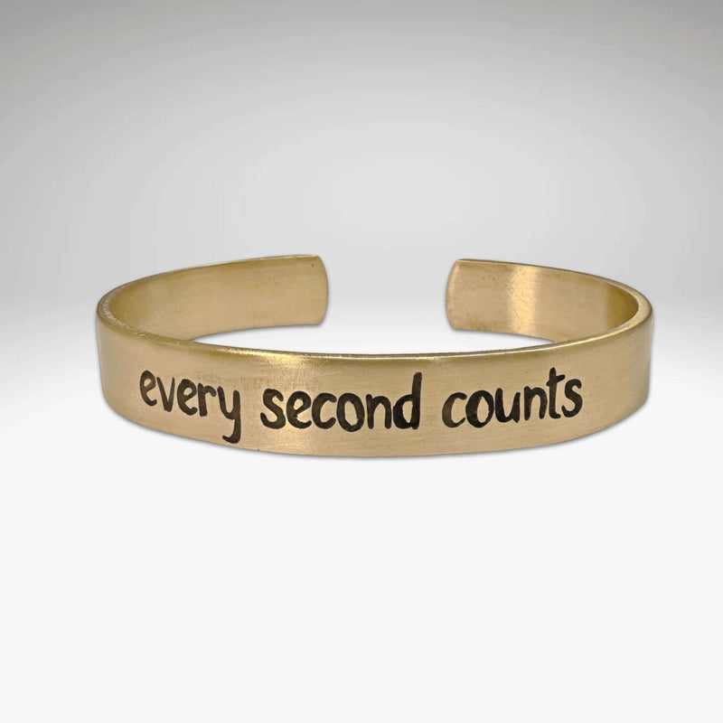 Every second counts - Bear Cuff Bracelet, gold cuff bracelet with etched text and bear design.
