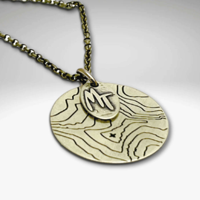 Explore MT Necklace featuring a topographic map design in Antique Brass with adjustable length.