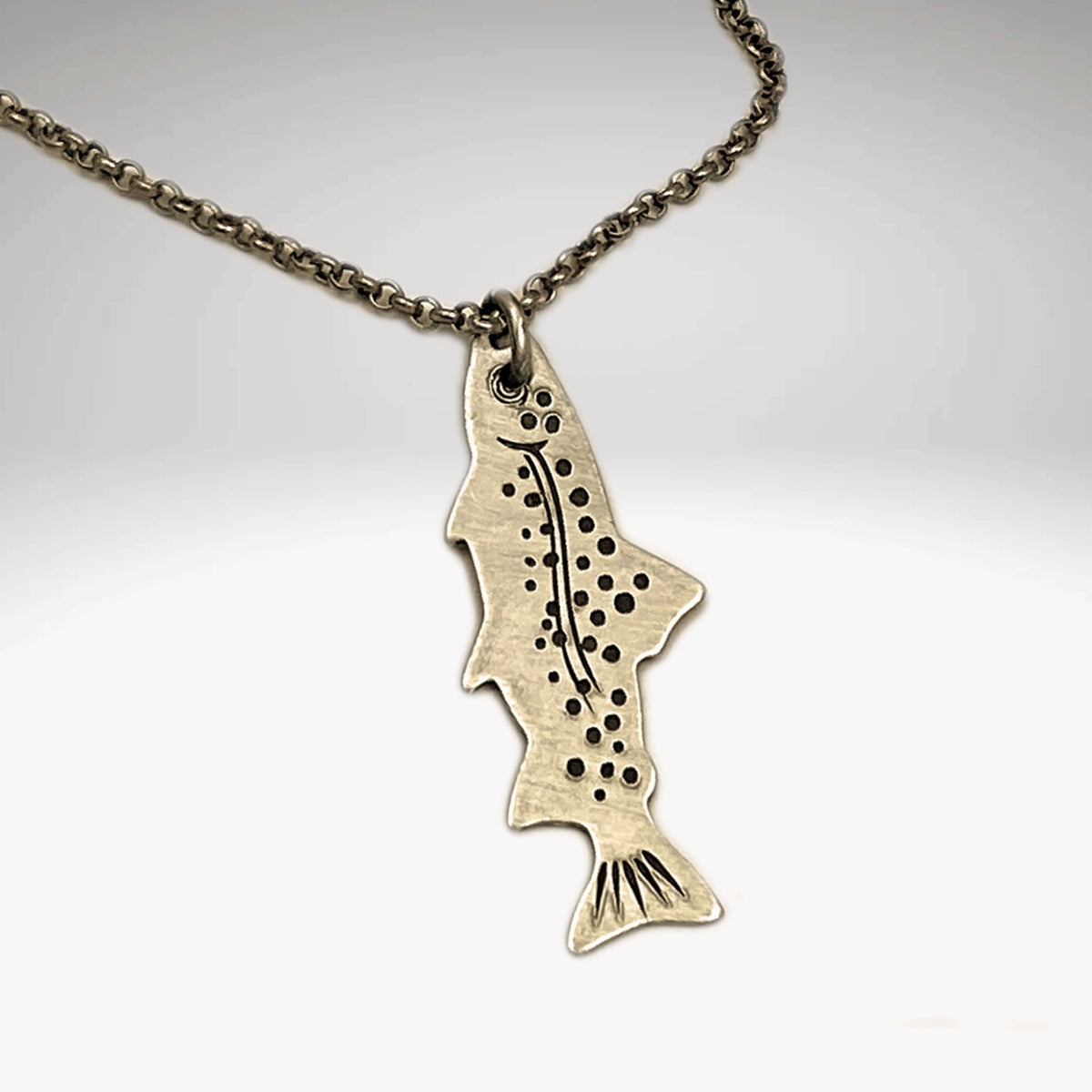 Fishin' Necklace featuring a detailed fish pendant on a cable chain in antique brass finish.