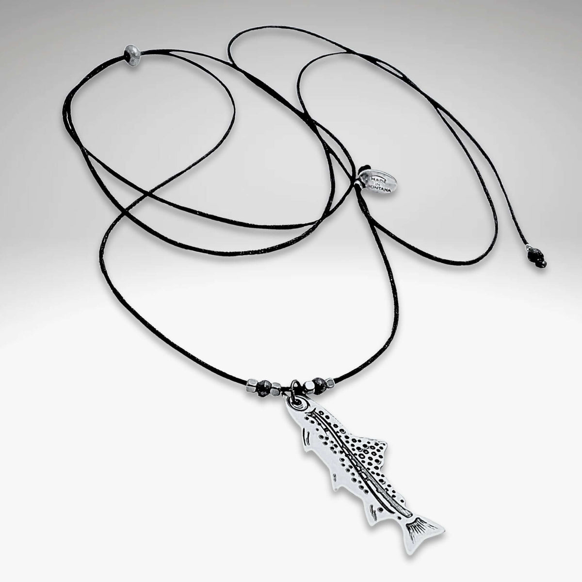 Fishin' Necklace featured with a detailed fish pendant on a black cord, representing aquatic life and nature.