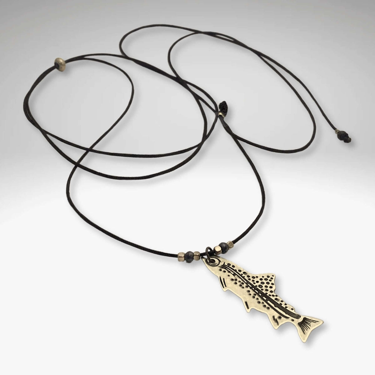 Fishin' Necklace featuring a fish pendant on a black cord, perfect for nature lovers and fishing enthusiasts.