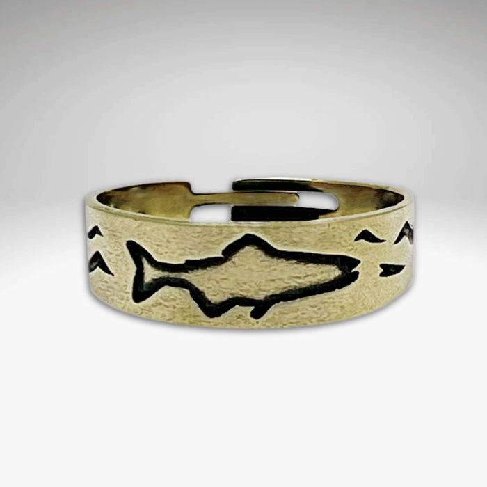 Fishing Adjustable Ring in antique brass featuring etched fish and wave design.