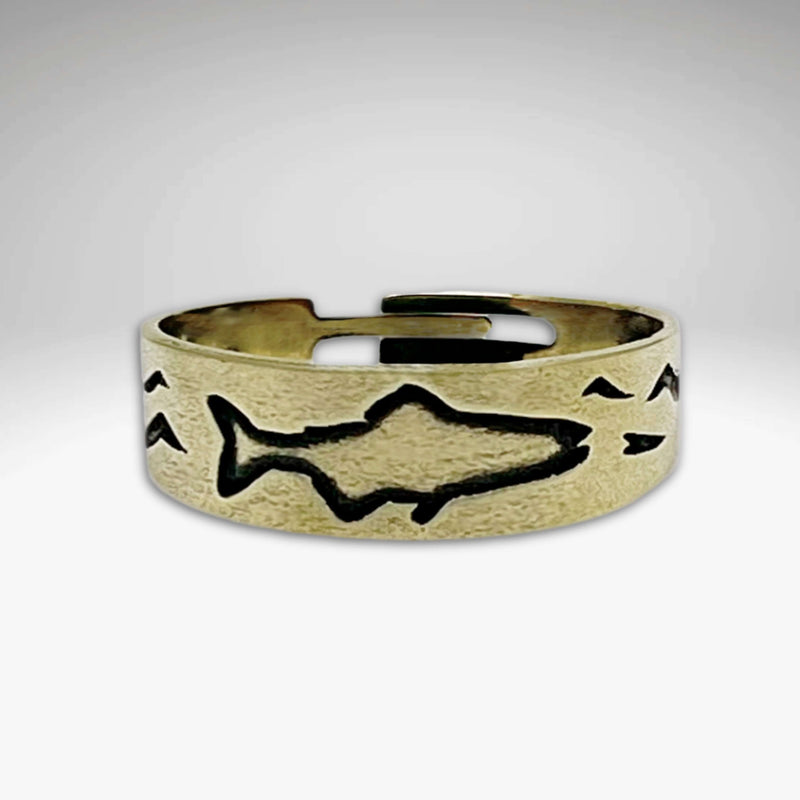 Fishing Adjustable Ring in antique brass featuring etched fish and wave design.