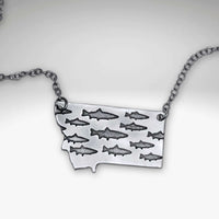 Fishing In Montana Necklace featuring intricate trout designs on a Montana state outline.