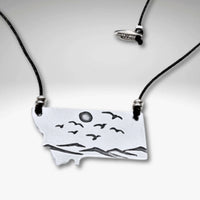 Flyover Montana - Necklace with Mountains birds and sun, featuring a scenic pendant of mountains, birds, and sun.