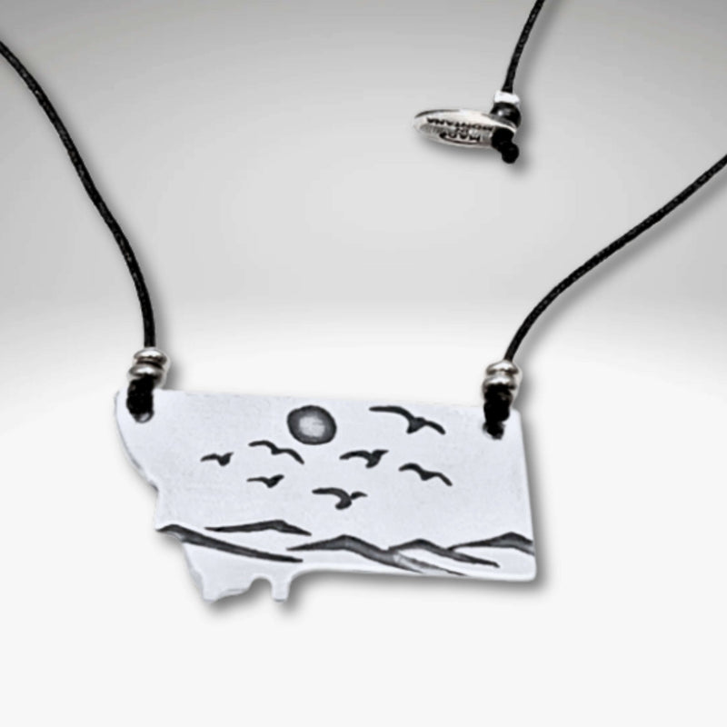 Flyover Montana - Necklace with Mountains birds and sun, featuring a scenic pendant of mountains, birds, and sun.