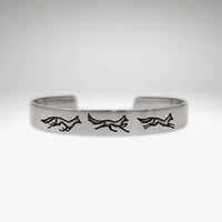Fox Run Cuff Bracelet featuring playful foxes in a game of chase, available in matte silver finish.