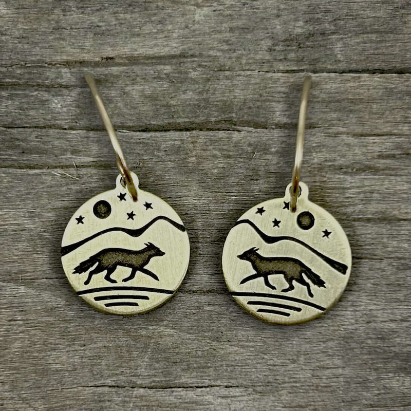 Fox Run Earrings showcasing etched fox design on brass with moon and stars, perfect for nature enthusiasts.