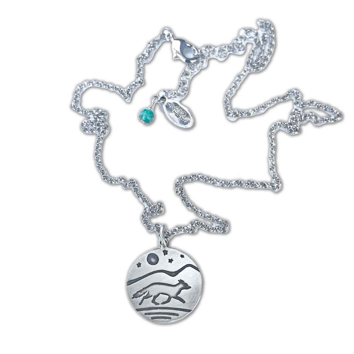 Fox Run Necklace featuring a handcrafted pendant of a running fox and night sky elements in matte silver finish.