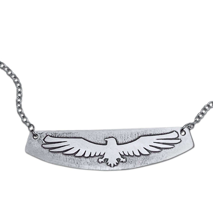 Freebird Necklace featuring an etched eagle design on a solid brass pendant with a small cable chain.
