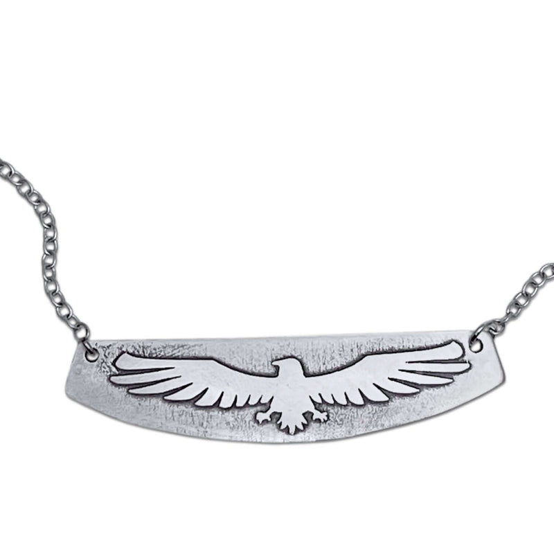 Freebird Necklace featuring an etched eagle design on a solid brass pendant with a small cable chain.