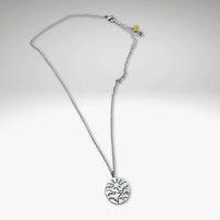 Going to the Sun Necklace featuring a mountain pendant on an adjustable silver chain.