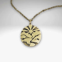 Going to the Sun Necklace featuring a mountain pendant in Antique Brass finish.