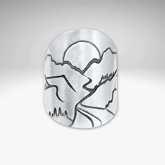 Going to the Sun Road Adjustable Ring showcasing etched landscapes of Glacier National Park.