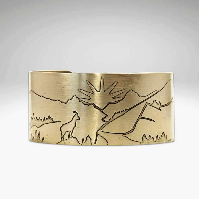 Going to the Sun Road Cuff Bracelet featuring etched mountains, sun goat, and road in antique brass finish.