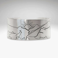 Going to the Sun Road Cuff Bracelet featuring mountain and sun goat engraving in matte silver finish.