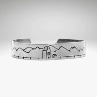 Grain Elevator On the Front Cuff Bracelet showcasing a detailed engraving of a peaceful landscape.