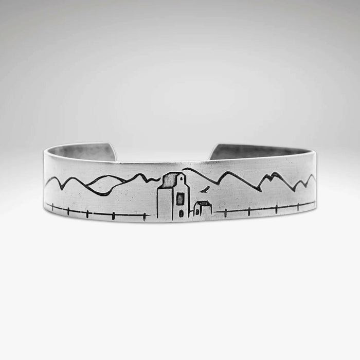 Grain Elevator On the Front Cuff Bracelet showcasing a detailed engraving of a peaceful landscape.