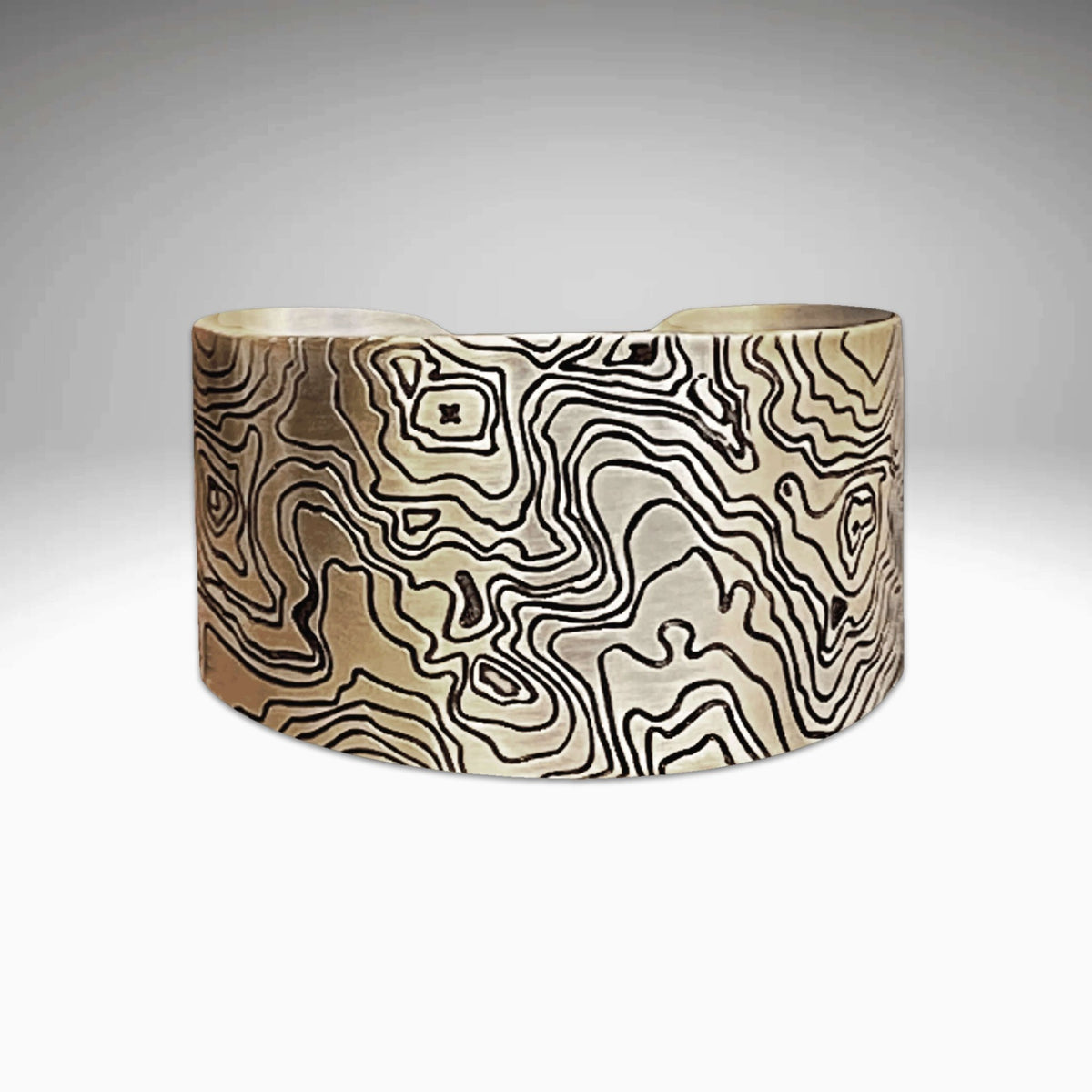 Grand Cuff in matte silver with intricate patterns, adjustable bracelet measuring 1.4" wide and 5.75" long.