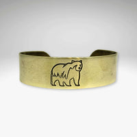 Griz Cuff Bracelet featuring a grizzly bear silhouette on a sleek cuff design, perfect for nature lovers.