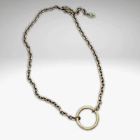 Halo Necklace on an adjustable cable chain with a hammered pendant and antique brass finish.