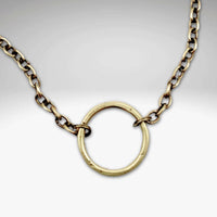 Halo Necklace featuring a hammered halo pendant on an adjustable cable chain in antique brass finish.