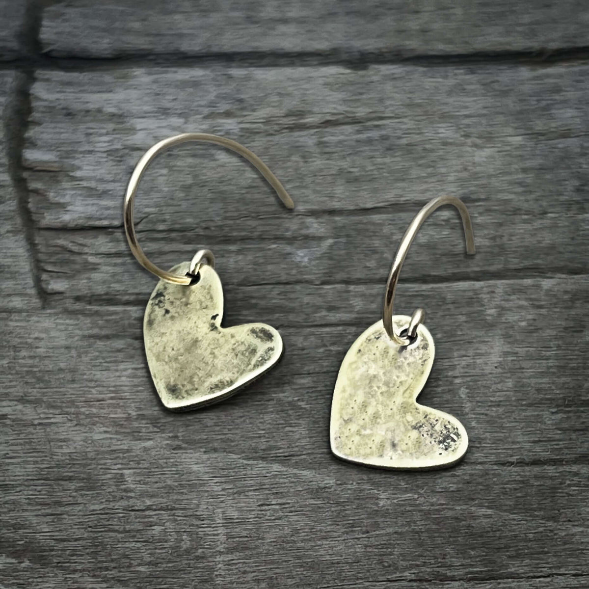 Heart Drop 2 Earrings featuring handmade hammered heart design in sterling silver, showcasing timeless love and friendship.