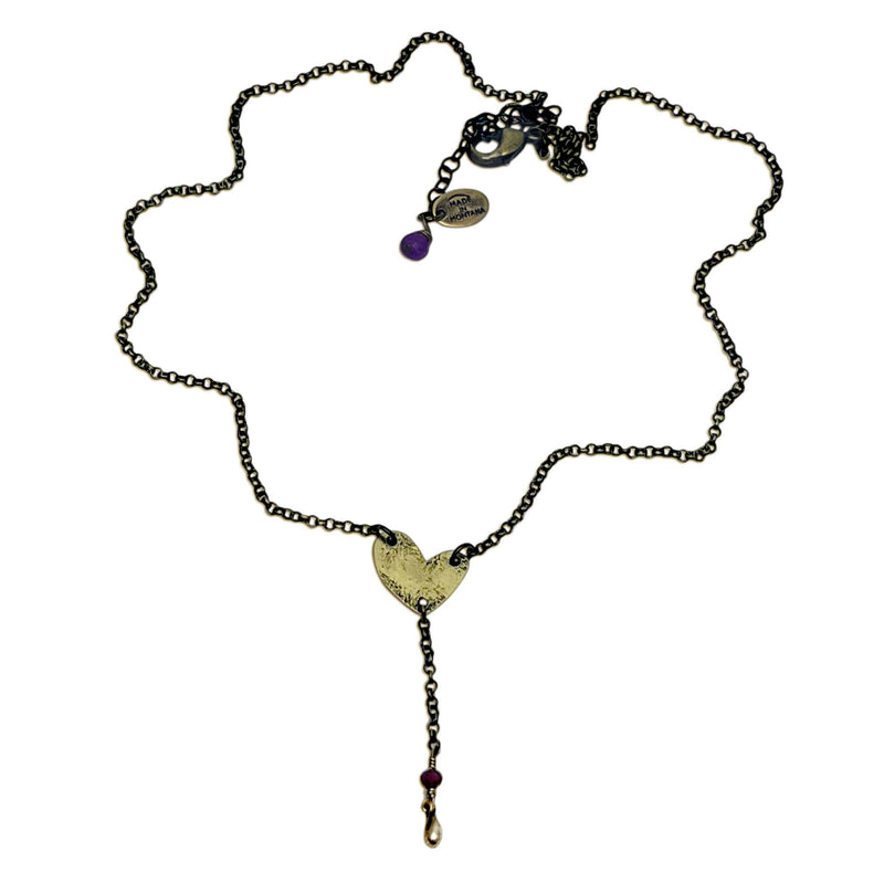 Heart Throb Y Necklace featuring a heart charm and purple gemstones, handmade in Montana.