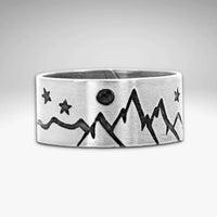 High Alpine Adjustable Ring showcasing mountain and star design in matte silver finish.