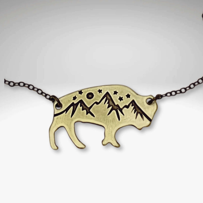 High Alpine Bison Necklace featuring a bison silhouette with mountains and stars design on a chain.
