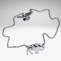 High Alpine Bison Necklace featuring a cutout bison with mountain design on an adjustable silver chain.