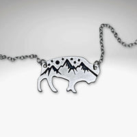 High Alpine Bison Necklace showcasing a bison silhouette with mountain and star designs, on a delicate chain.