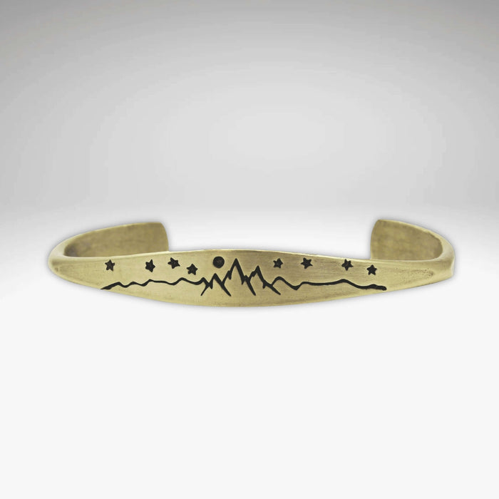 High Alpine Cuff Bracelet featuring mountain, stars, and moon design on a signet cuff.