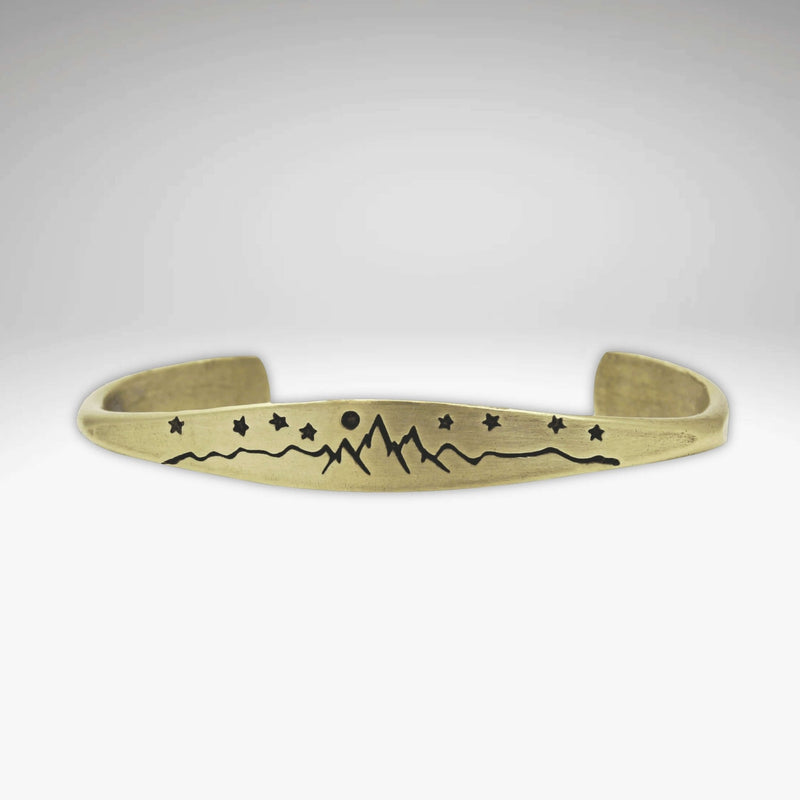 High Alpine Cuff Bracelet featuring mountain, stars, and moon design on a signet cuff.