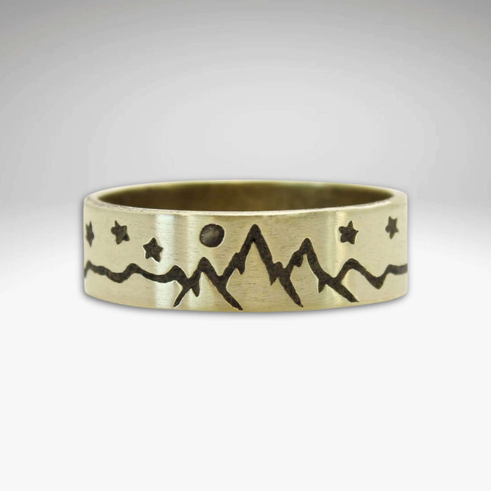 High Alpine Mountain Ring in antique brass finish with mountain and star design, 0.25" wide, handmade in Montana.