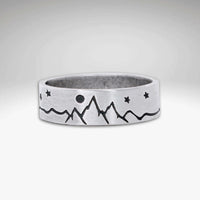 High Alpine Mountain Ring featuring mountain and star design in matte silver finish.
