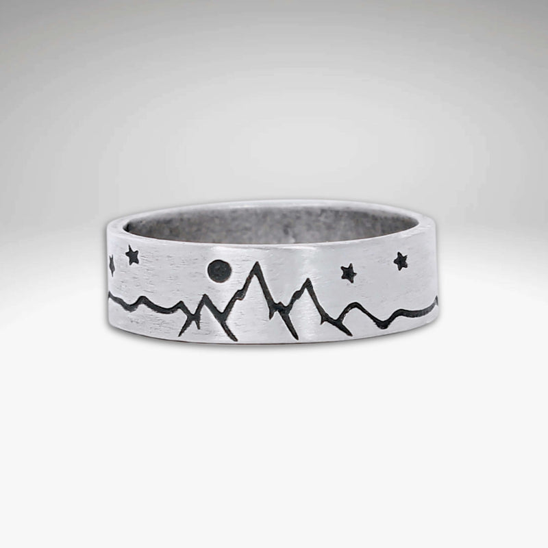 High Alpine Mountain Ring featuring mountain and star design in matte silver finish.