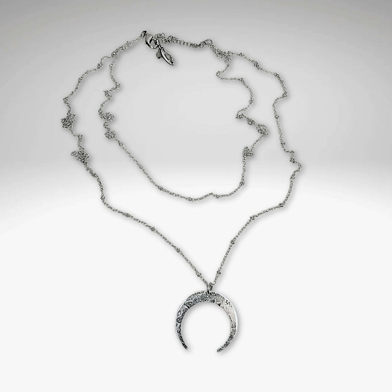Horned Moon Necklace on satellite chain in matte silver with layered chains, elegant jewelry for any style.