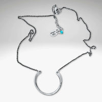 Horseshoe Necklace with a lightly hammered semi-circle pendant on a delicate rolo chain.