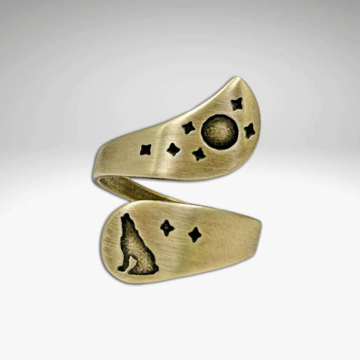 Howl Adjustable Ring in antique brass with wolf, moon, and stars engravings.